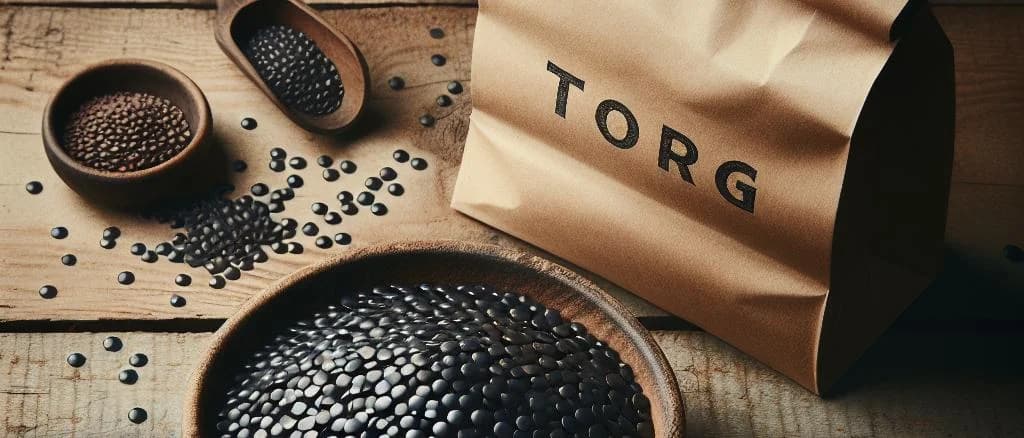 Various types of packaged black lentils on a wooden table with rustic background
