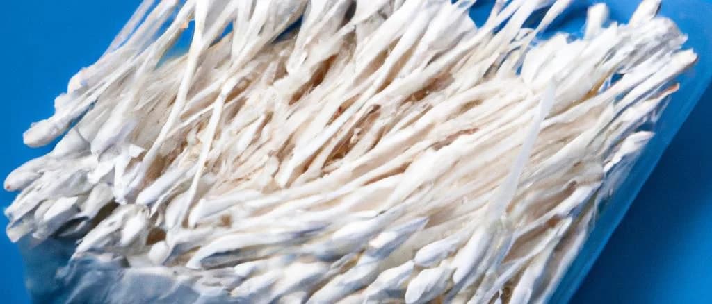 Assorted cotton buds in various packaging on a neutral background