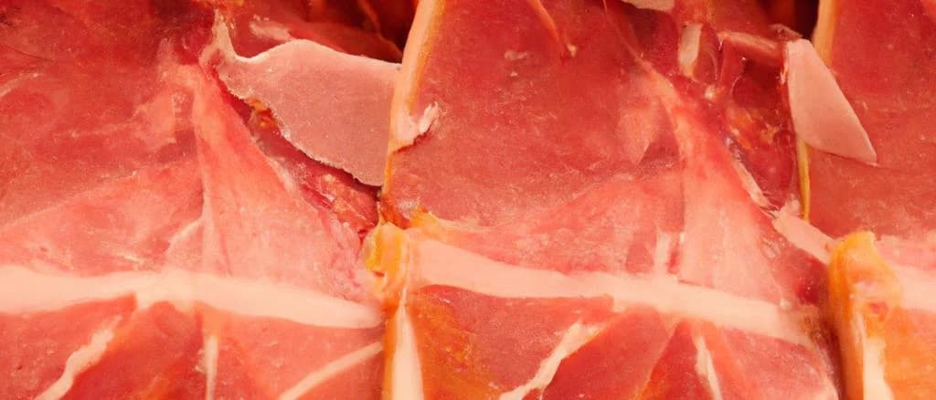 Variety of Spanish hams displayed with traditional packaging