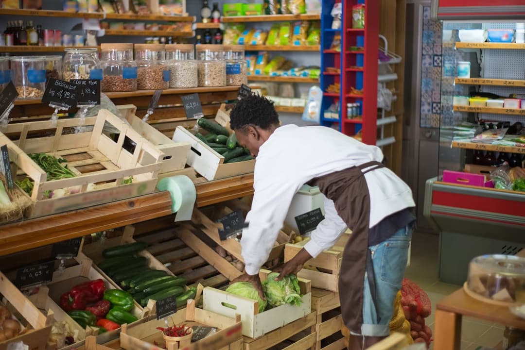 guy arranging food display