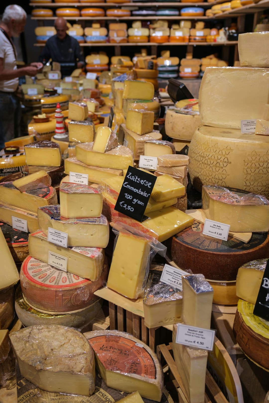 Variety of Cheeses Displayed in Cheese Shop
