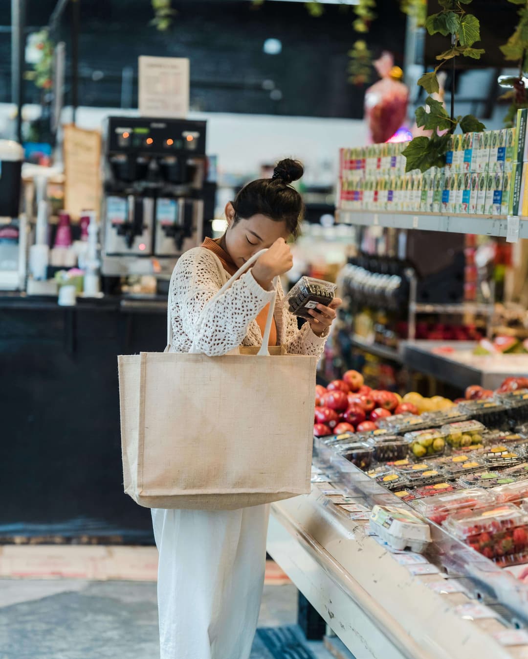 Woman Buying Groceries in a Supermarket