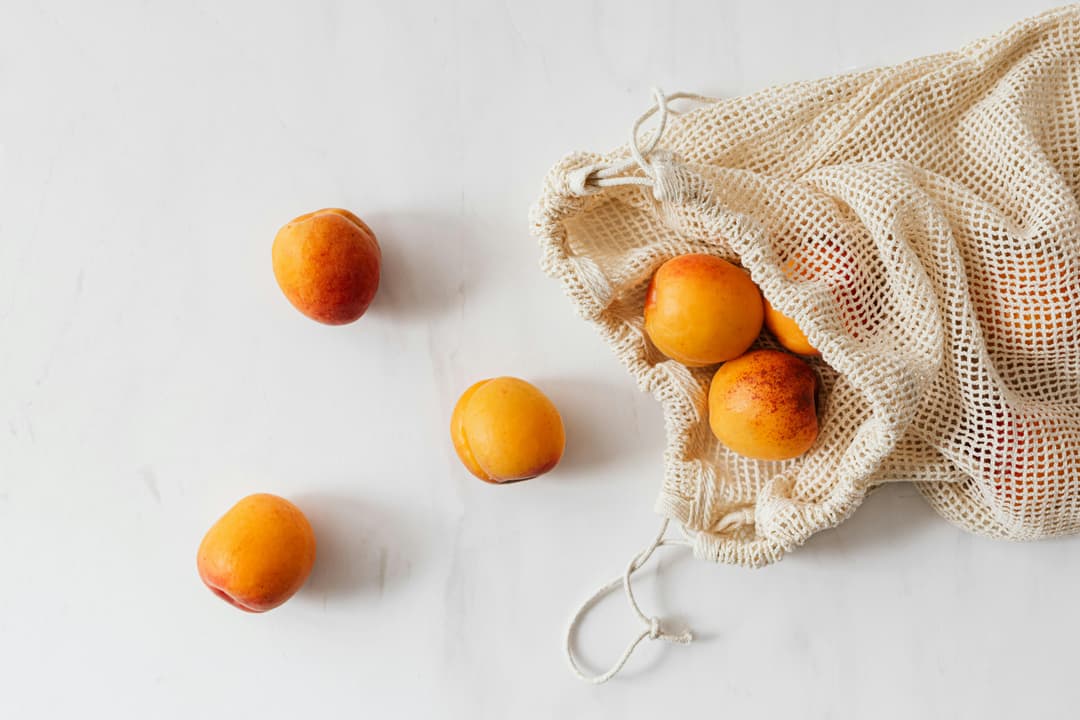 fruits contained in cotton mesh bag