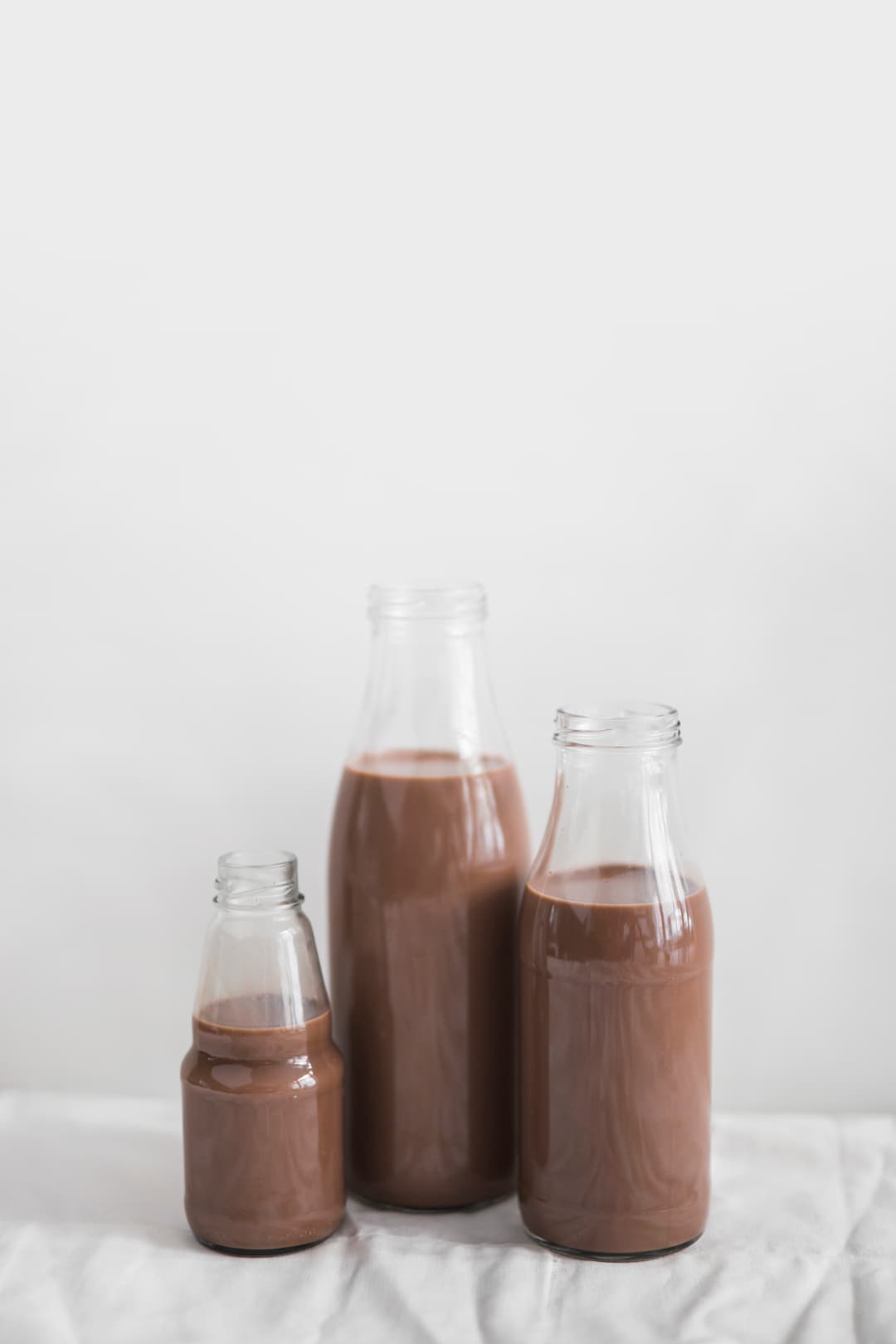 still-life-chocolate-milkshake-bottle-against-white-background